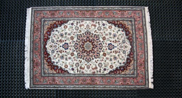 fine tabriz rug on cleaning pads