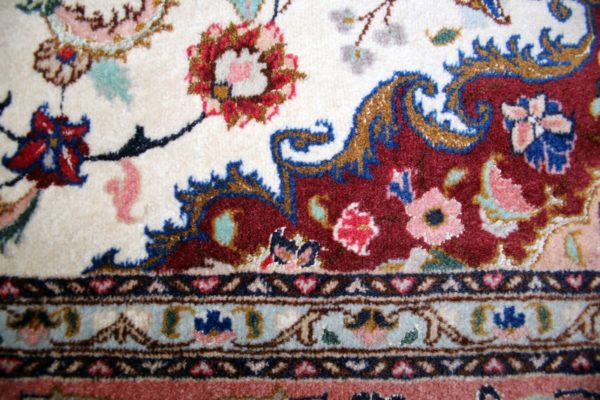 close up of a fine tabriz rug