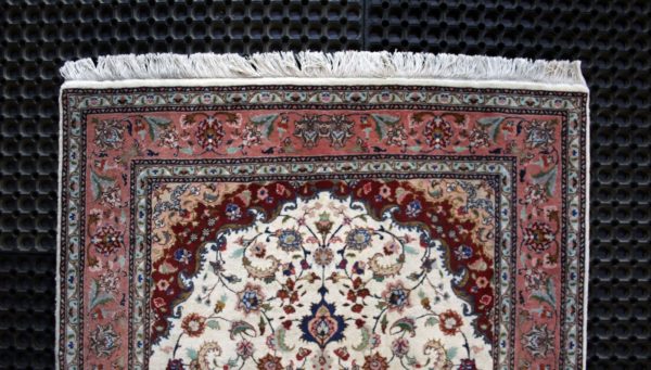 close up of a fine tabriz rug