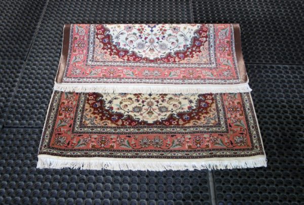folded Fine tabriz rug