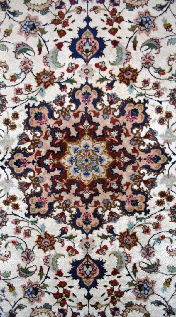close up of a fine tabriz rug
