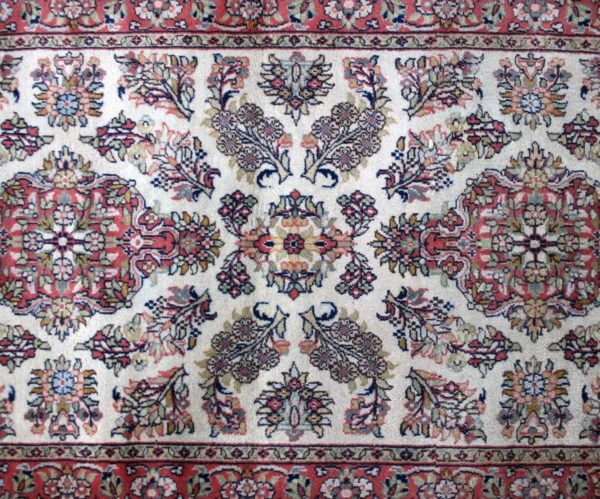close up of a qom rug