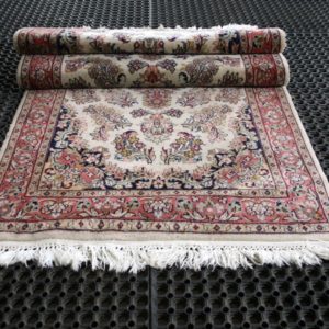 a folded qom rug