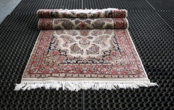 a folded qom rug
